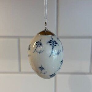 Royal Copenhagen Porcelain Blue Fluted Egg Ornament in Nest - 2.5 Inches